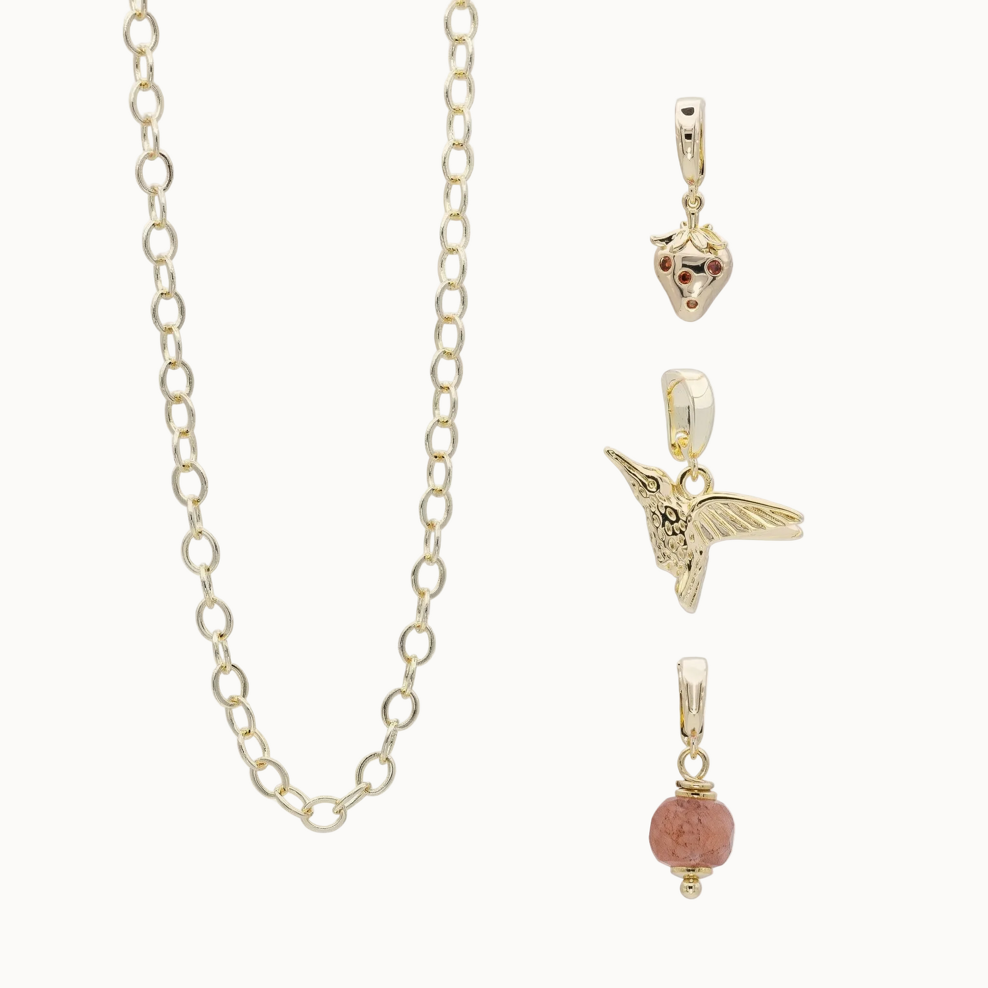 Modulares Schmucksystem. Schmuckset aus Kette und drei Charms vergoldet.